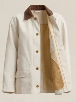 Off-white cotton barn jacket displayed open showing soft tan inner lining, brown corduroy collar, and brass button closure