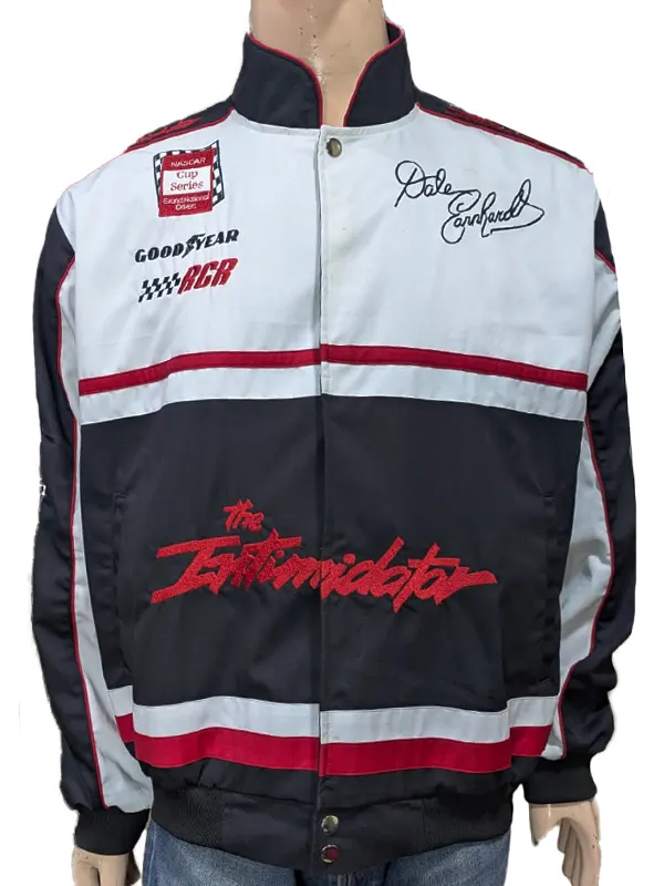 Front view of the black and white racing jacket on a mannequin, featuring a snap-button closure, a stand-up collar, chest logos, a script signature, and large red text across the lower half.
