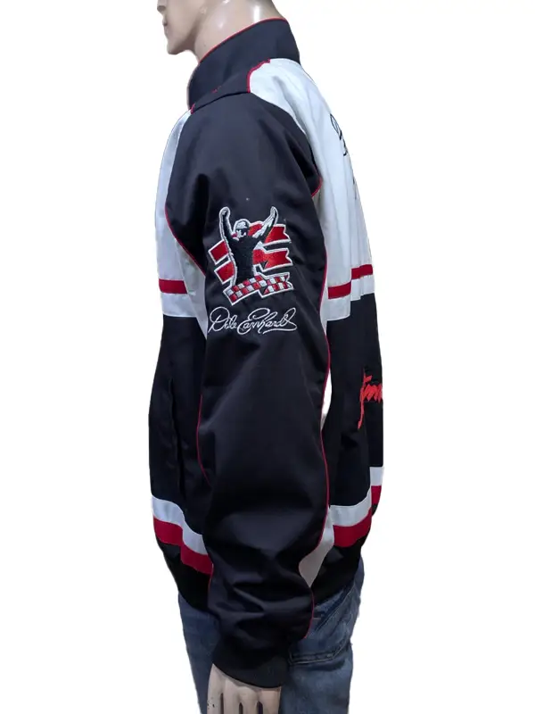 Side profile view of a mannequin wearing the black and white racing jacket, highlighting the left sleeve adorned with a custom victory silhouette graphic and an embroidered signature below it.