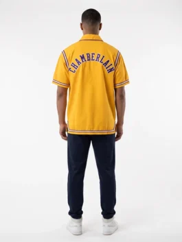 Premium yellow polyester Wilt Chamberlain Lakers 1972 Finals Warm-Up Jacket with a traditional shirt style collar.
