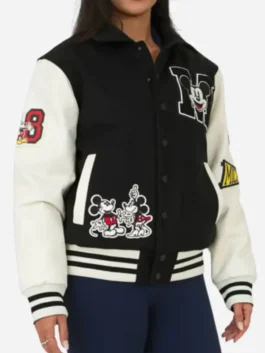 Black and white polyester Disney Adult Unisex Black Varsity Jacket featuring character patches and shirt collar.