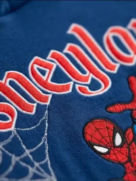 Full look of blue fleece Spiderman Disneyland Hoodie featuring rib knitted cuffs and zip front.